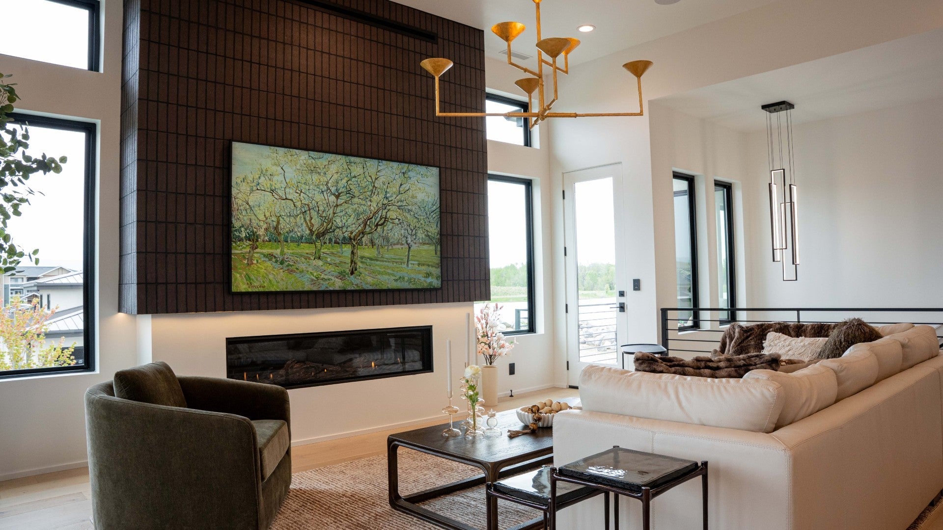 Luxurious living room with a fireplace and painting centerpiece