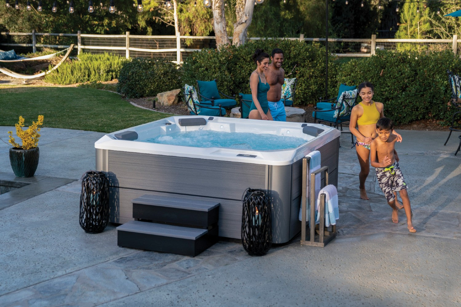 Family outside using a hot tub