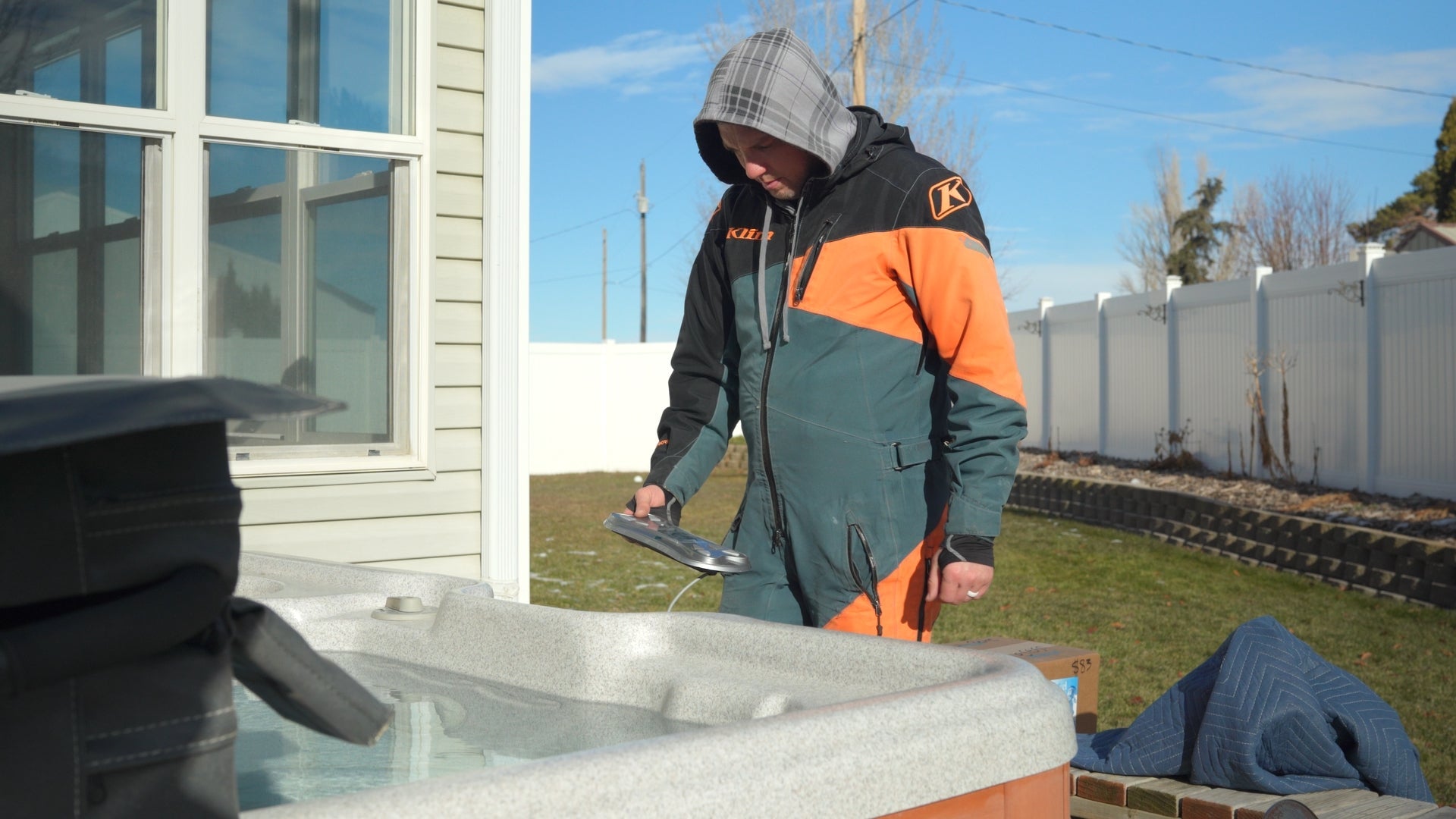 A spa technician diagnosing a hot tub