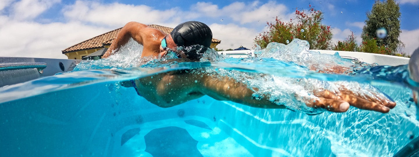 Man swimming in swim spa